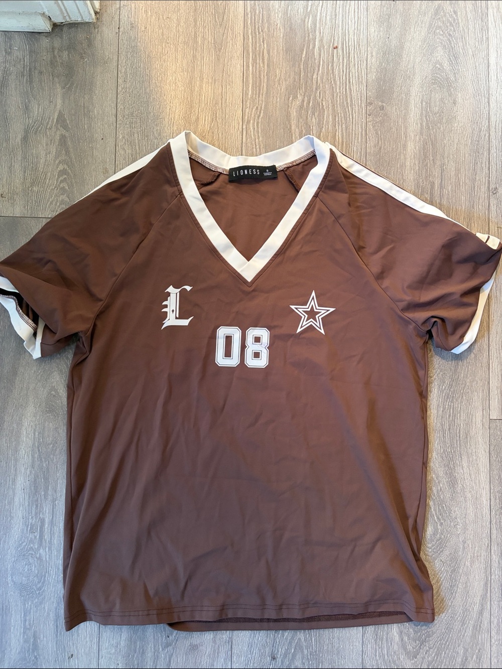 Lioness Brown V-Neck oversized t with White Trim and 08 Star soccer shirt